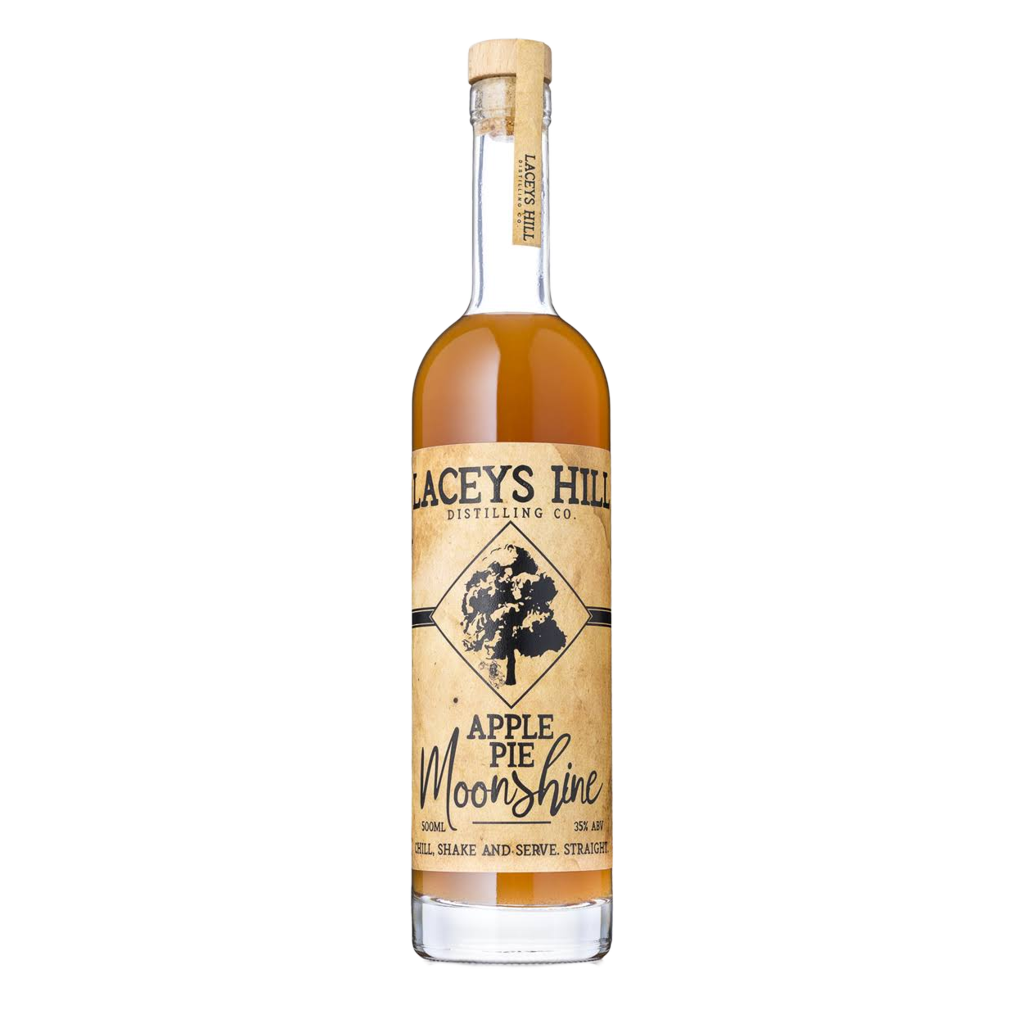 A bottle of Apple Pie Moonshine with a label that includes the brand name and the flavor of the spirit. The bottle is clear, showcasing the amber-colored liquor.