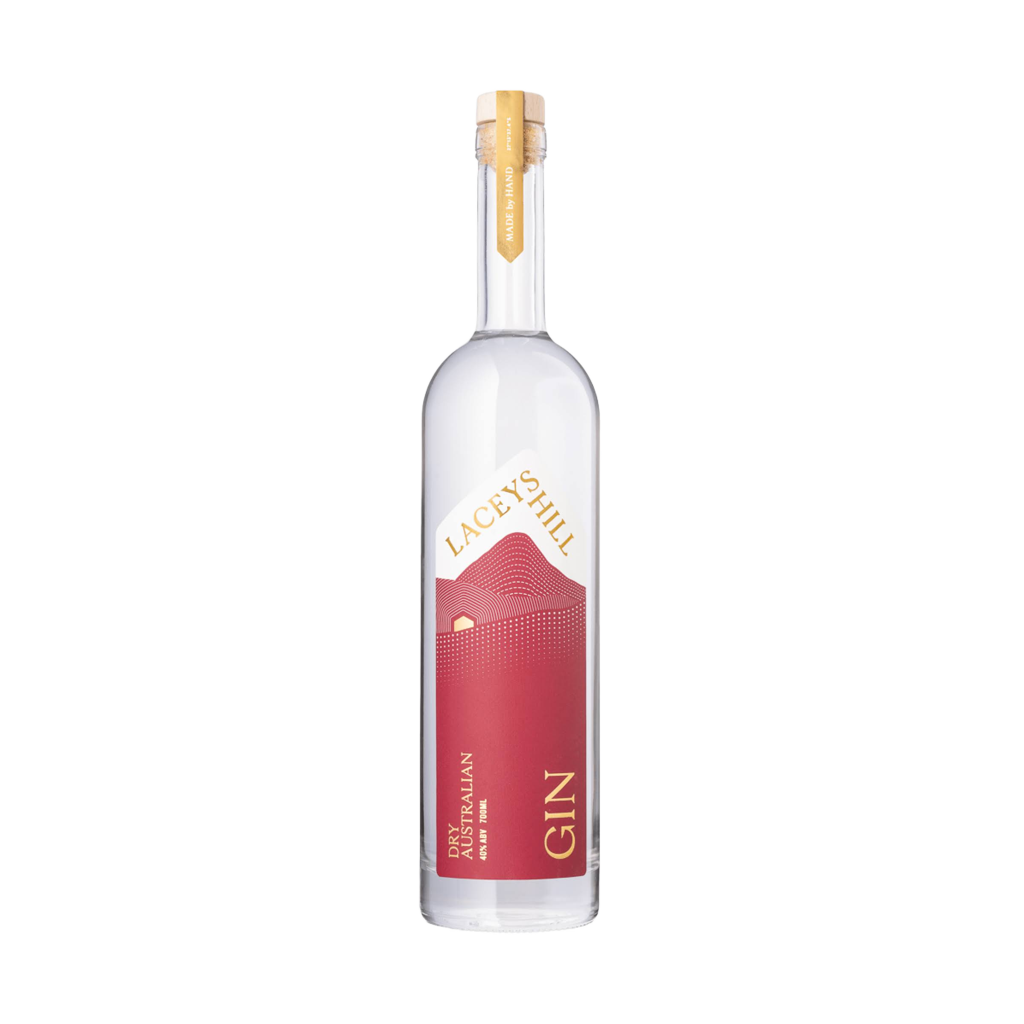 A clear glass bottle of Lacey's Hill Dry Australian Gin with a red label and yellow text, indicating the brand and type of gin.