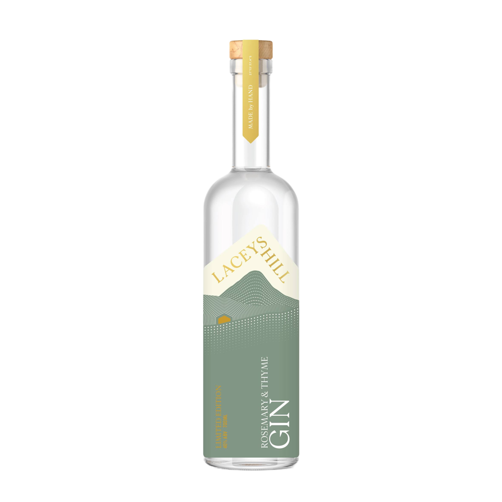 A bottle of Laceys Hill Rosemary & Thyme Gin with a label that includes the brand name and 'Gin' underneath a graphic of a mountain range. The bottle cap is gold-colored.